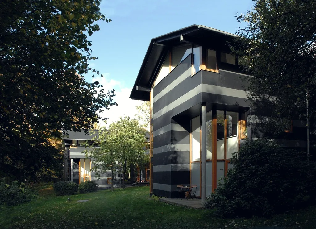 Contemporary low-rise housing set among trees